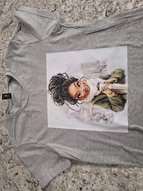 A full-color illustrated portrait printed on a gray t-shirt