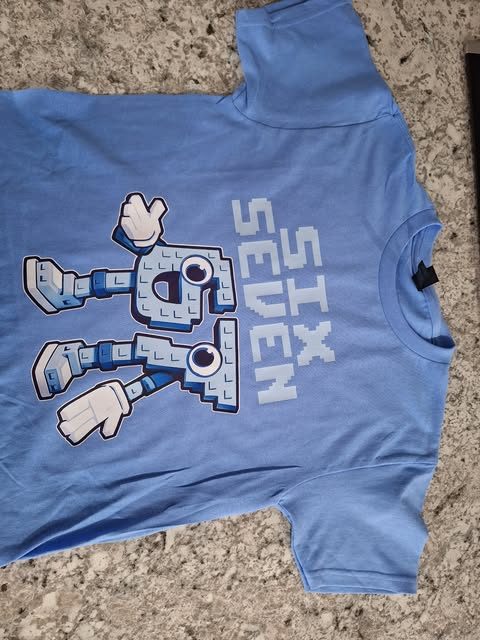 A custom graphic print on a light blue t-shirt